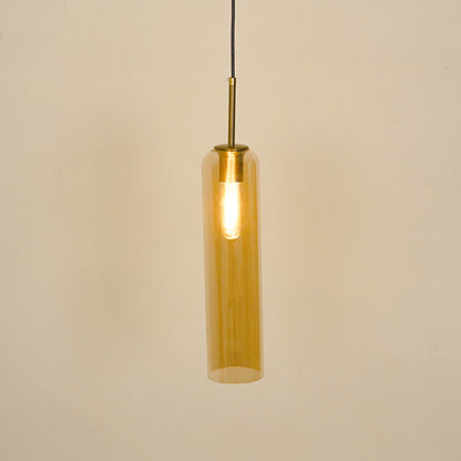 Amber glass pendant light illuminated with warm glow for stylish dining room ceiling decor.