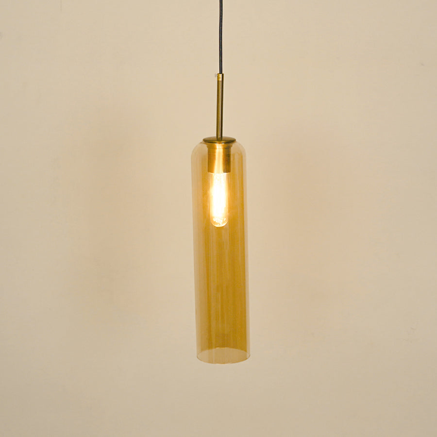 Amber glass pendant light illuminated with warm glow for stylish dining room ceiling decor.