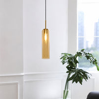 Amber glass pendant light enhancing dining spaces with luxurious charm and contemporary elegance.