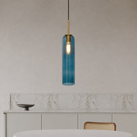 Blue glass pendant light enhancing dining spaces with luxurious charm and contemporary elegance.