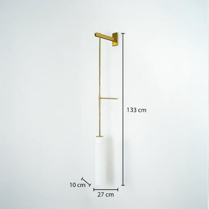 Sleek gold metal long stem hanging wall lamp with a cylindrical white shade displaying a 133cm height dimension.