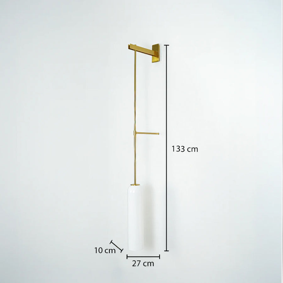 Sleek gold metal long stem hanging wall lamp with a cylindrical white shade displaying a 133cm height dimension.