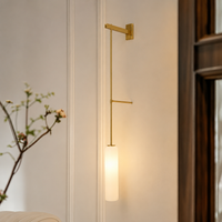 Lifestyle image of white float suspension wall sconce for elegant bedroom decor styling and modern home interior design.