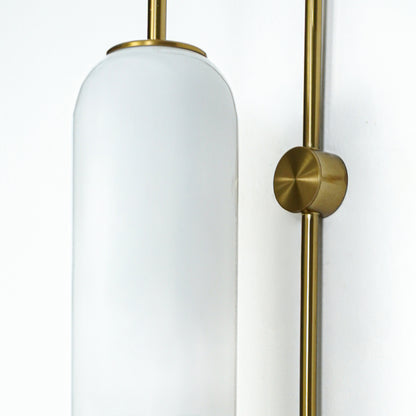 Closeup of white frosted glass and gold metal wall light for modern hallway and premium decor styling spaces.