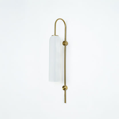 Modern gold metal wall light with white frosted glass shade for elegant bedroom and luxury decor spaces.