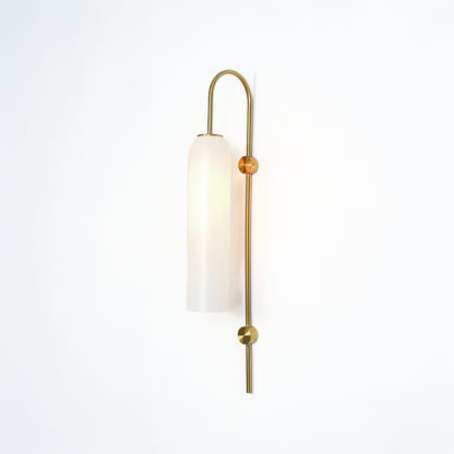 Modern gold metal wall light with white frosted glass shade for stylish bedroom and luxury decor spaces.

