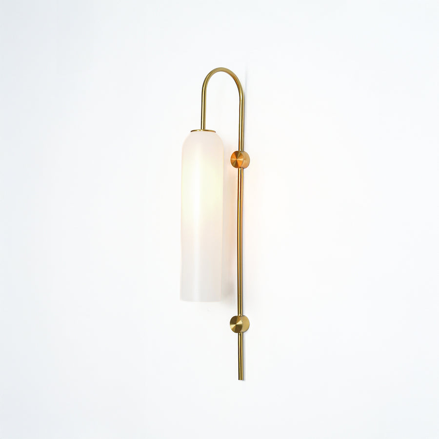 Modern gold metal wall light with white frosted glass shade for stylish bedroom and luxury decor spaces.

