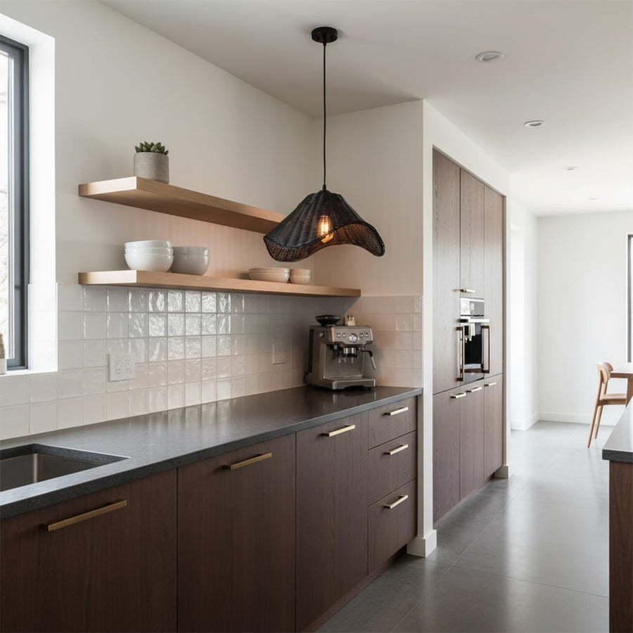 Black rattan pendant light adding a bold contemporary accent with organic curves and artisanal weaving.