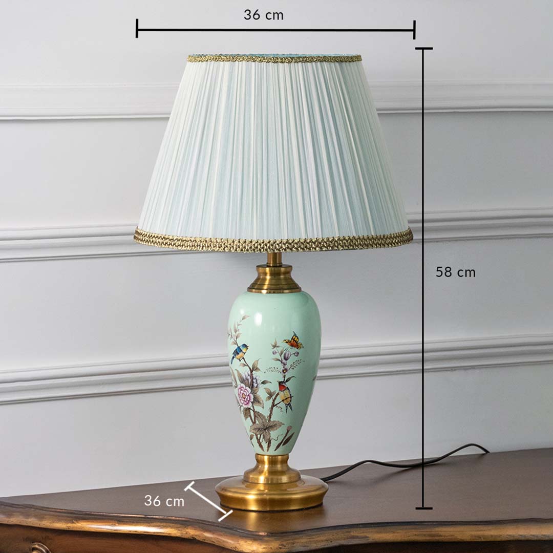Mint green floral ceramic table lamp with pleated shade displayed on white background featuring height 58 cm and width 36 cm for accurate size reference.