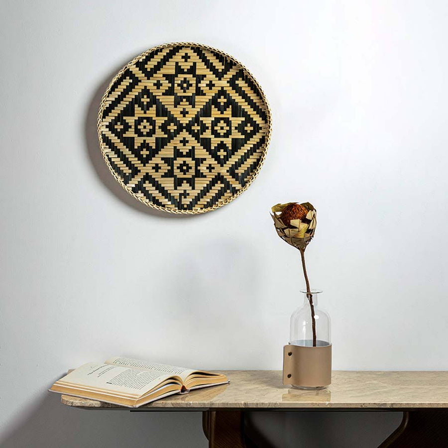 Handcrafted black and natural seagrass wall basket with diamond pattern for living room and boho home décor styling.