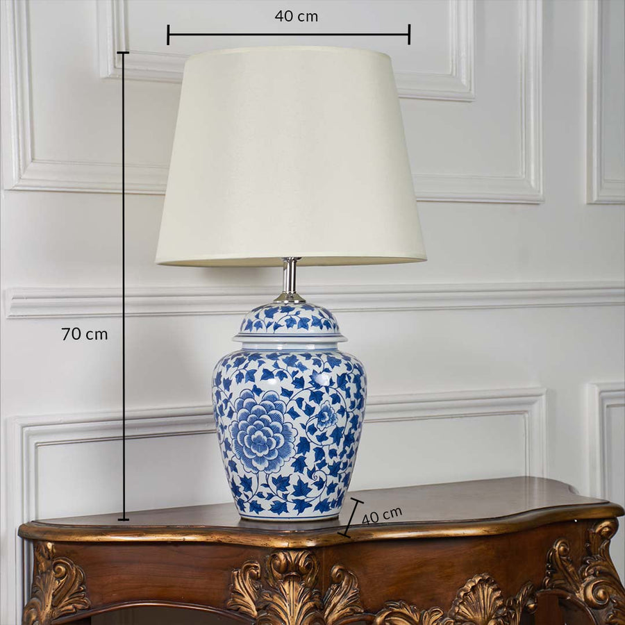 Blue and white ceramic table lamp shown with dimensions of 70 cm height and 40 cm shade width along with a 40 cm base width.