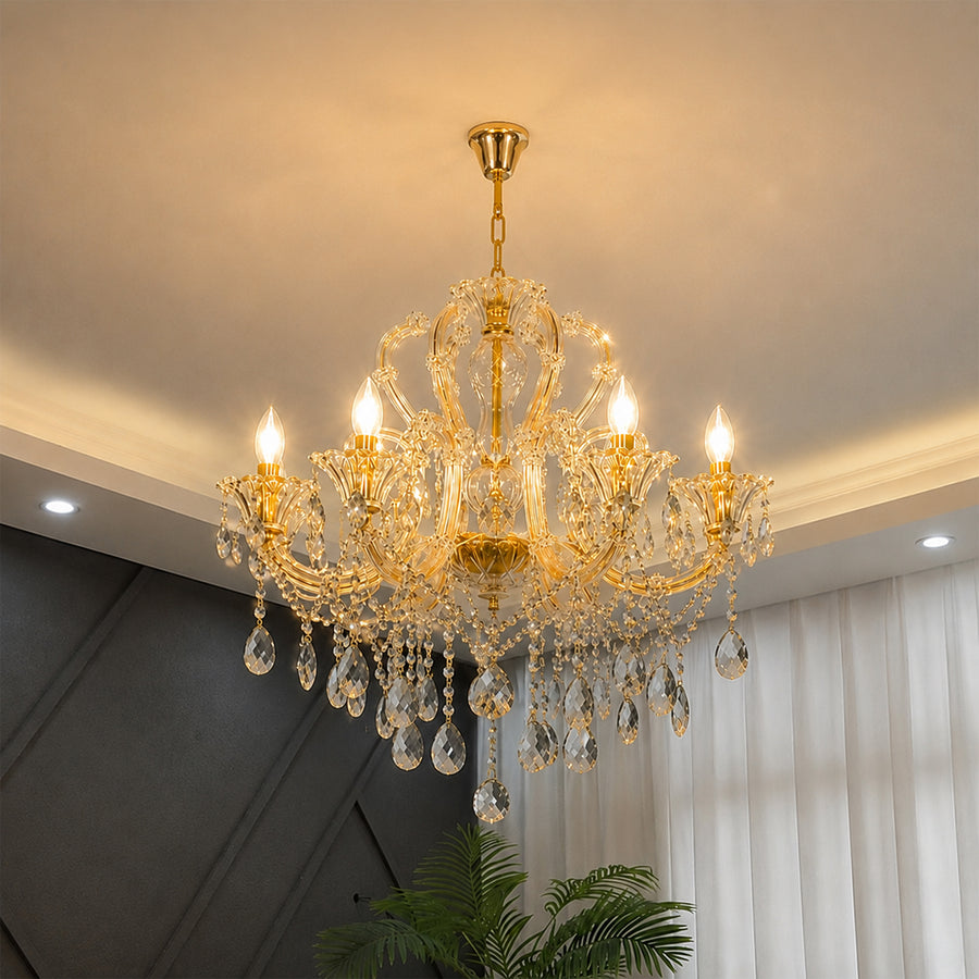 Lifestyle image of gold metal candle style chandelier for luxury living room decor styling with elegant crystal detailing.