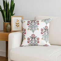 Soft cotton cushion cover with bold floral embroidery placed on a modern sofa creating a vibrant nature inspired décor accent with a breathable gentle and skin friendly fabric finish.