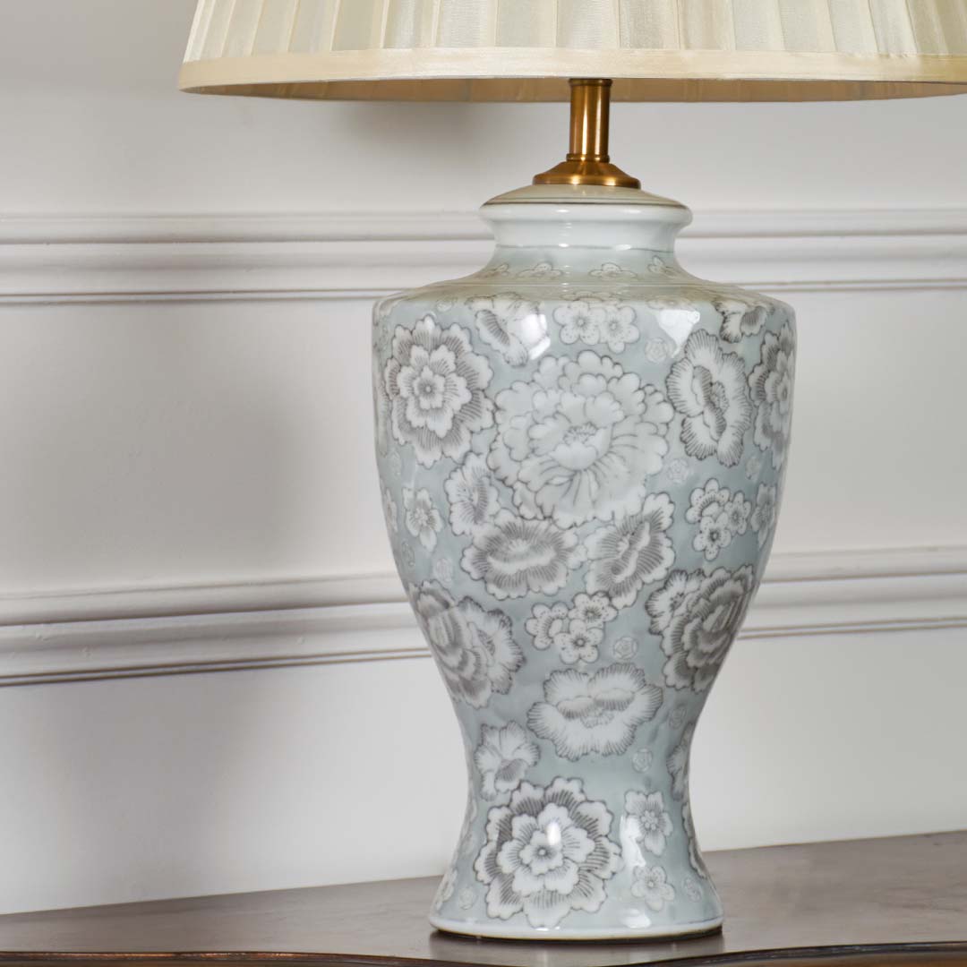 Grey floral ceramic table lamp base showcasing intricate handcrafted detailing with classic pattern and premium finish.