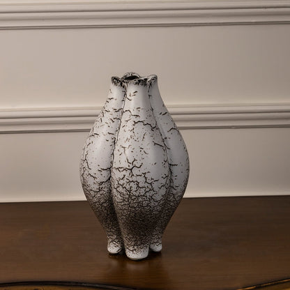 Crackle glazed ceramic vase displayed on white background highlighting its artistic texture and organic shape.