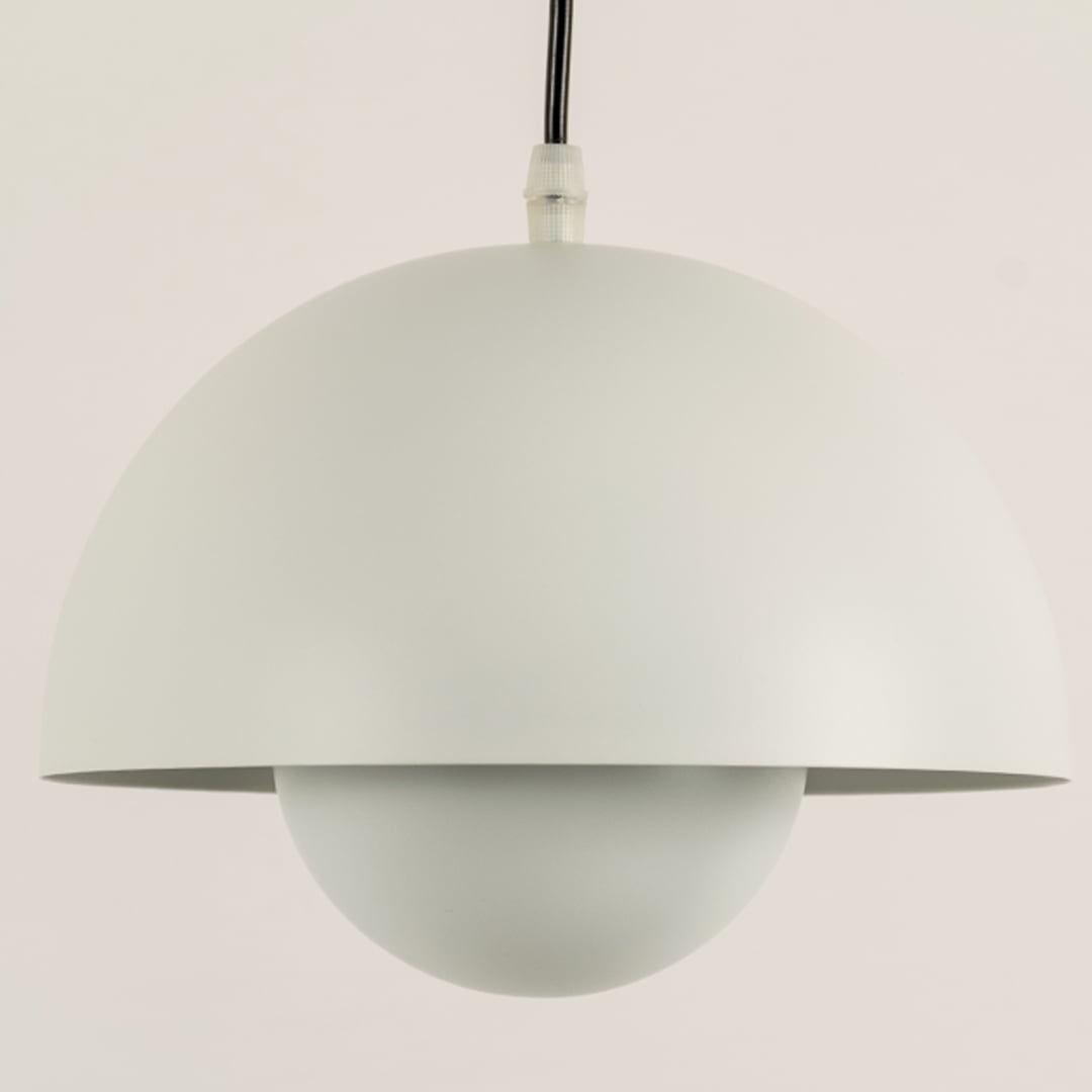 Closeup of white dome pendant light showing smooth matte texture and round minimalist design.