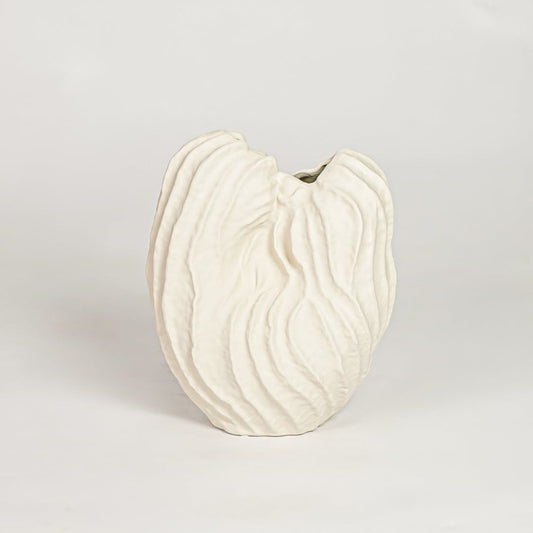 White flutter ceramic vase with sculpted organic design isolated on white background for elegant home decor display.