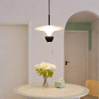 Elegant white pendant light glowing above dining table for luxury modern home and dining room decor styling.