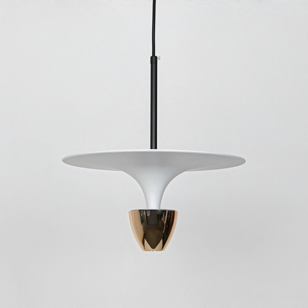 Minimal white pendant light with gold metallic accent suspended for stylish dining room decor inspiration.