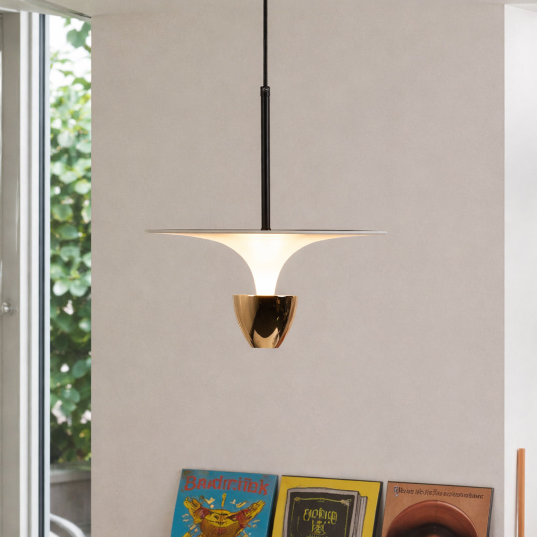 Modern black and white pendant light hanging in stylish living room and contemporary dining space decor styling.