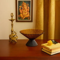 Amber glass decorative bowl with XO embossed texture styled on a modern table for a sophisticated and elegant home decor accent.