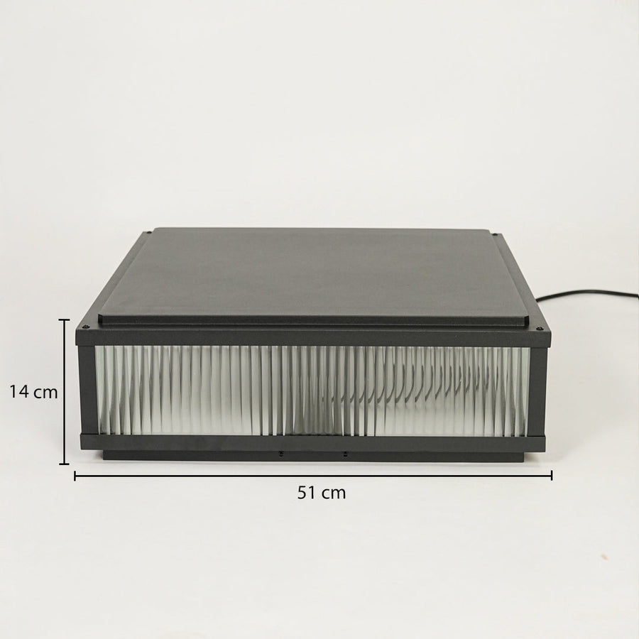 Modern rectangular outdoor wall light with black metal frame and ribbed glass diffuser on neutral background 51 cm width 14 cm height ideal for exterior decor lighting.

