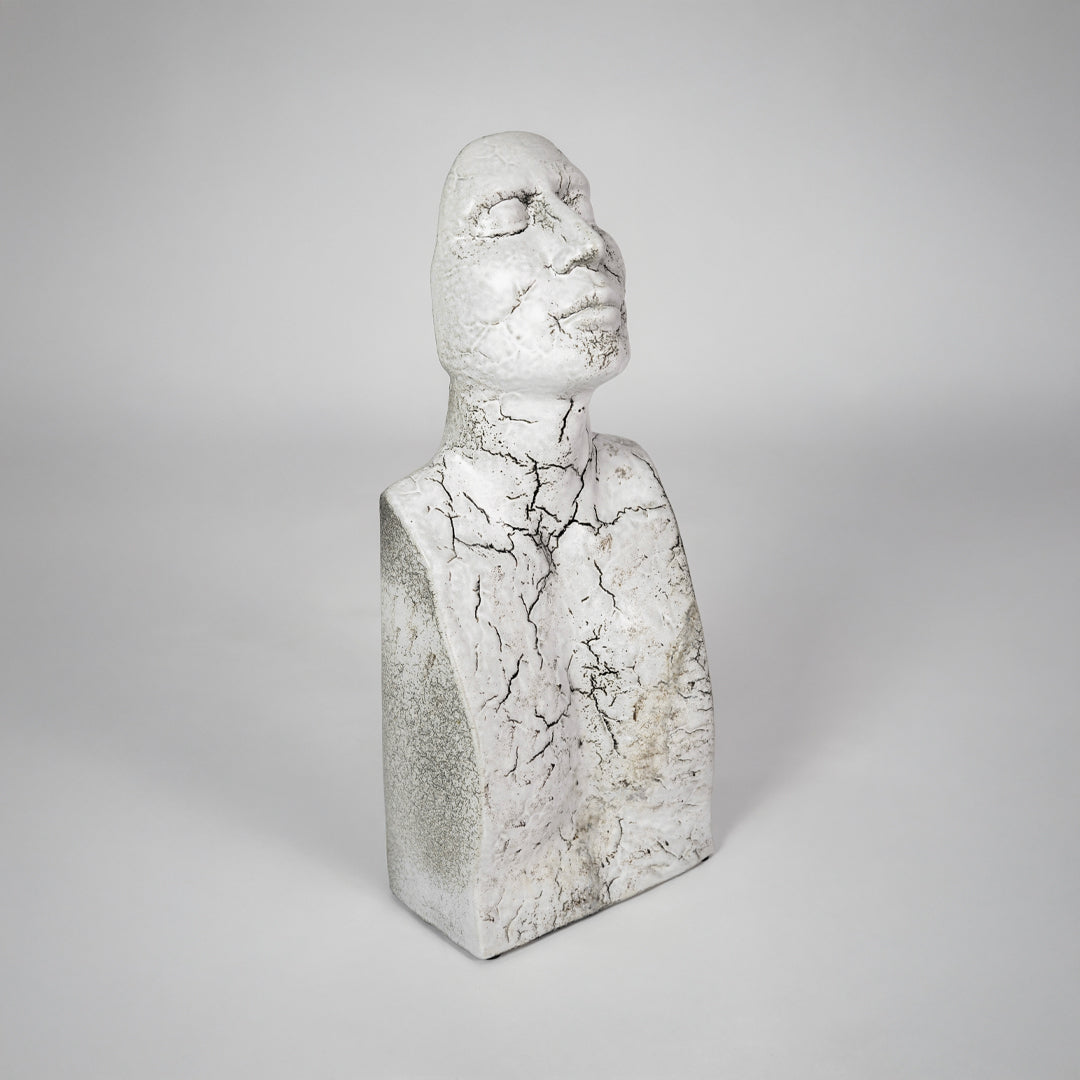 White textured bust sculpture for elegant shelf placement and contemporary living room decor styling statement piece.