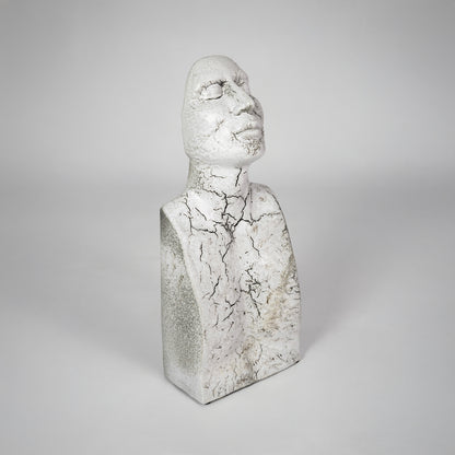 White textured bust sculpture for elegant shelf placement and contemporary living room decor styling statement piece.