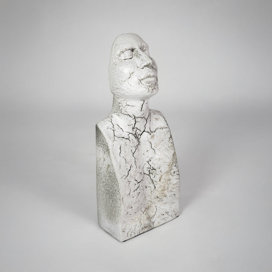 White textured bust sculpture for elegant shelf placement and contemporary living room decor styling statement piece.
