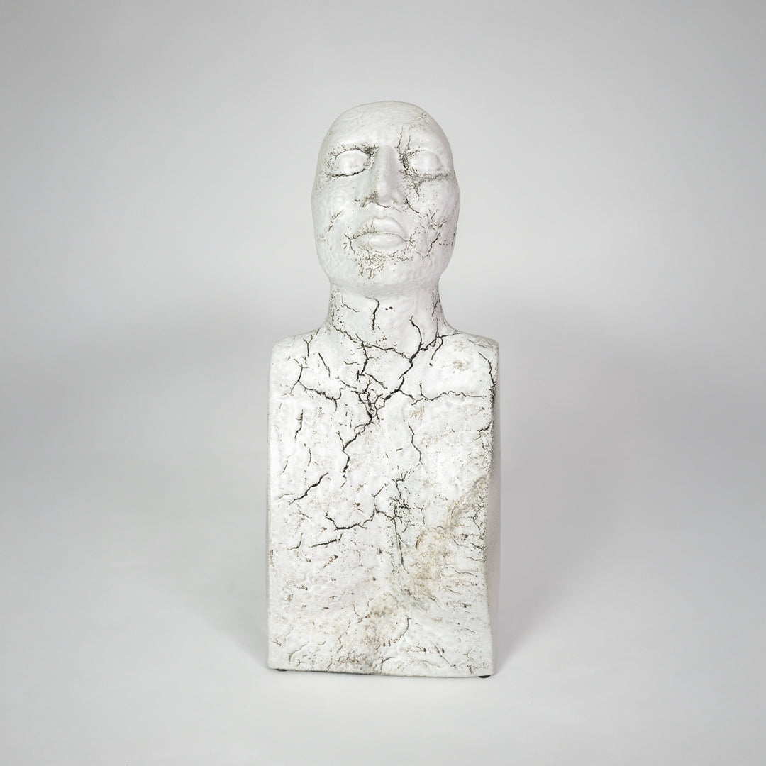 White marble texture face sculpture for modern shelf placement and artistic indoor home decor styling accent piece.