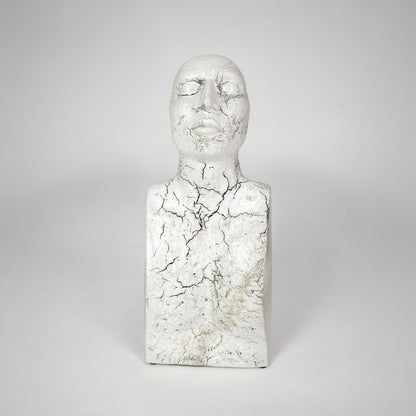 White marble texture face sculpture for modern shelf placement and artistic indoor home decor styling accent piece.