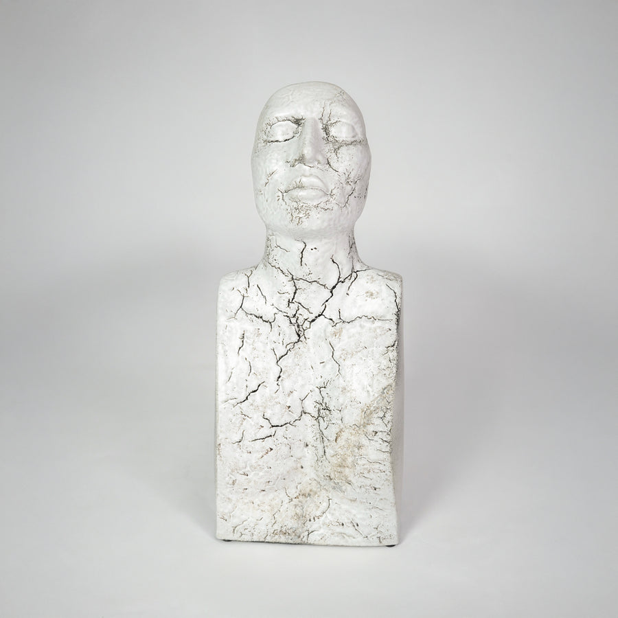 White marble texture face sculpture for modern shelf placement and artistic indoor home decor styling accent piece.