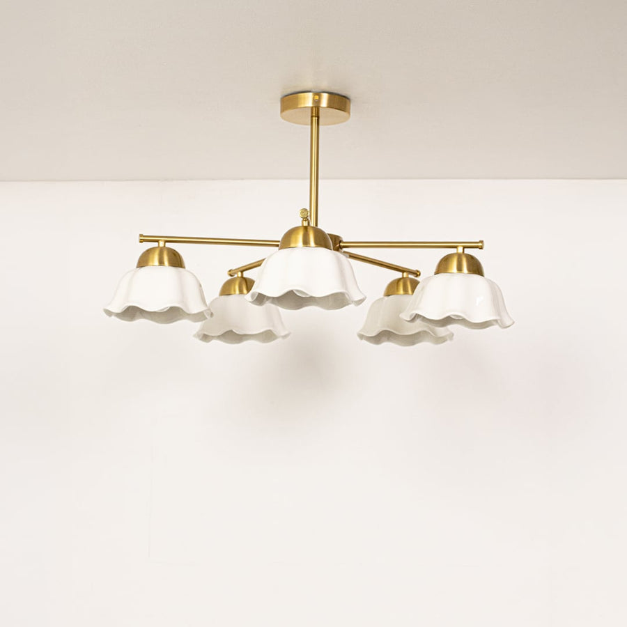 Metal ceiling light with white petal shaped shades displayed with lights off on a clean white background showcasing its modern design.