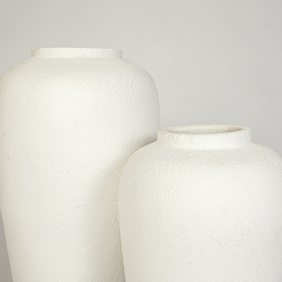 Closeup image of white ceramic vase set for elegant interior decor styling with artistic matte finish.
