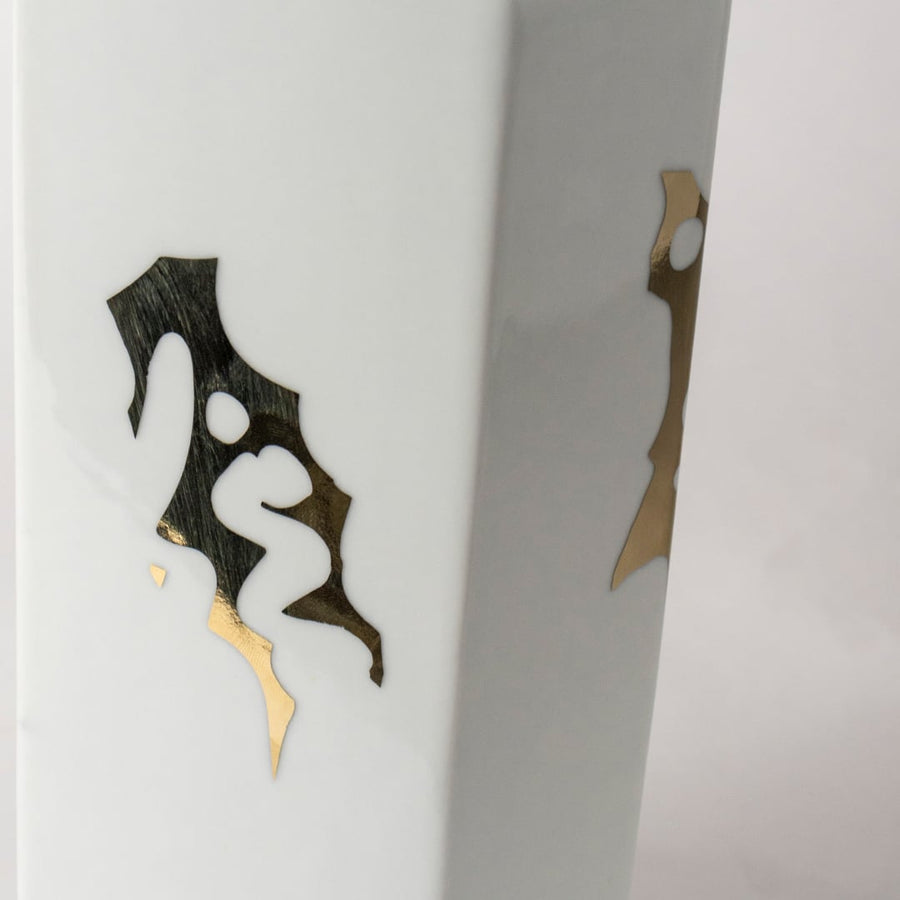 White ceramic jar with black abstract horse artwork in a close-up view ideal for modern console décor and stylish home accents.