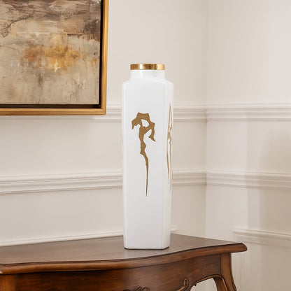 White ceramic jar with elegant gold ribbon artwork perfect for luxury living room décor and stylish tabletop placement.