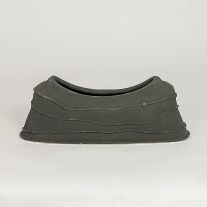 Modern black ceramic decorative serving bowl ideal for fruit display on dining table centerpiece and stylish home decor.
