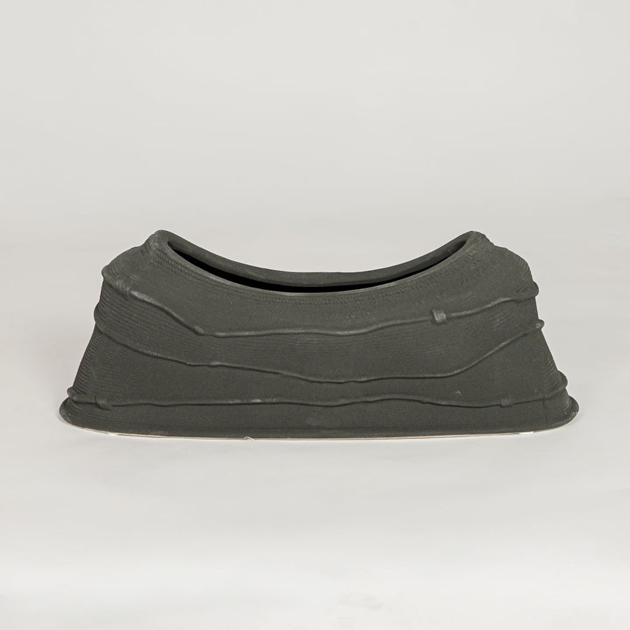 Modern black ceramic decorative serving bowl ideal for fruit display on dining table centerpiece and stylish home decor.