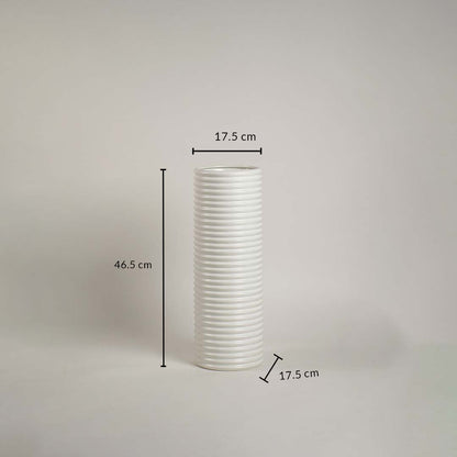 White ribbed ceramic vase measuring 46.5 cm height and 17.5 cm width shown on white background with handcrafted finish.