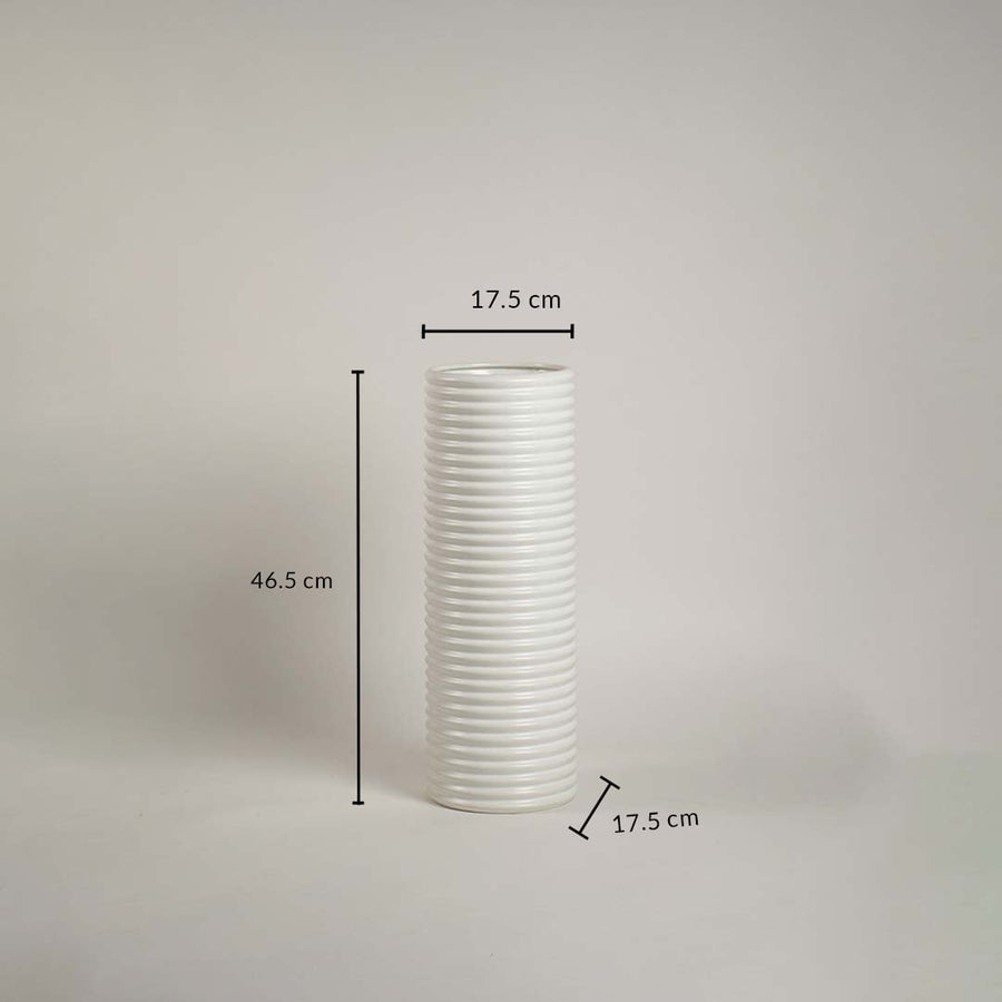 White ribbed ceramic vase measuring 46.5 cm height and 17.5 cm width shown on white background with handcrafted finish.