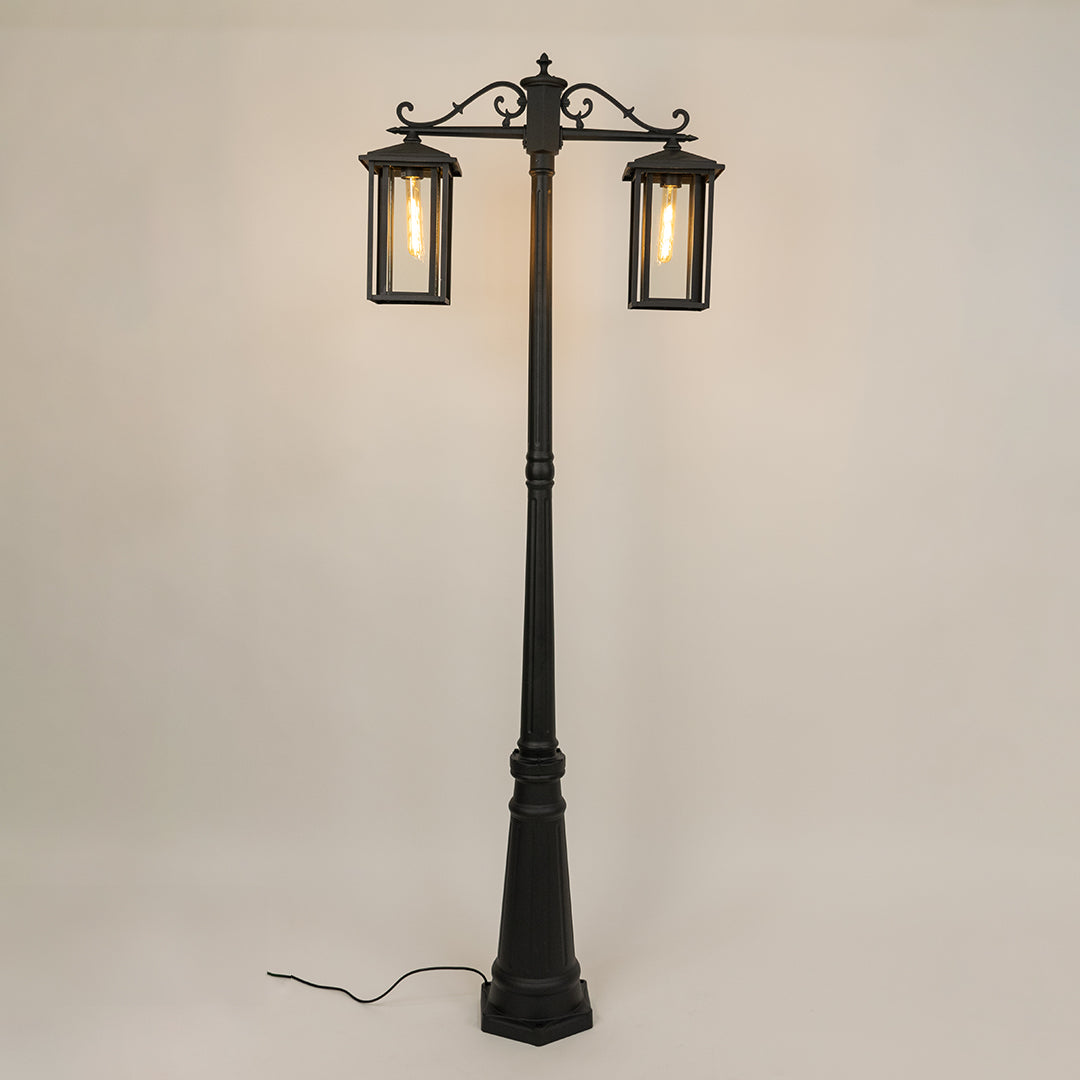 Vintage outdoor street lamp with dual lantern shades for elegant exterior decor styling use.