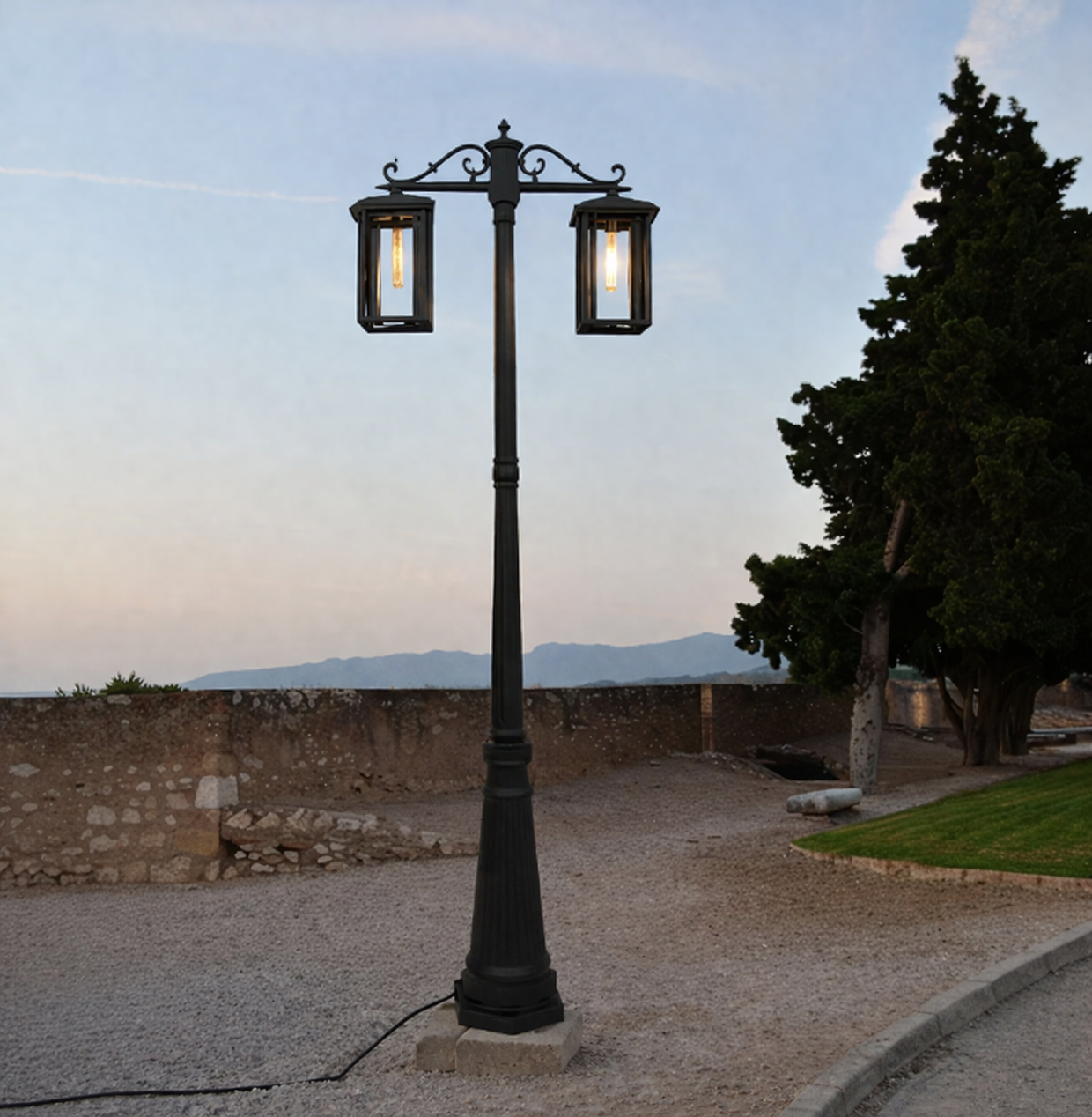 Black outdoor street lamp styled beside pathway for luxury garden and exterior decor ambiance.