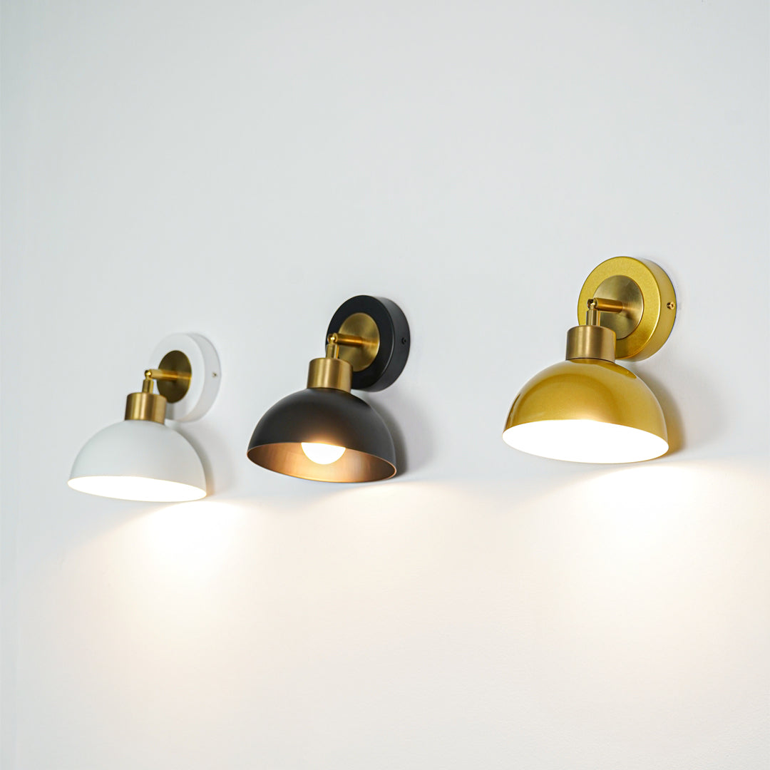 Wall lights with dome shades emitting warm ambient glow ideal for modern interior wall decor styling.