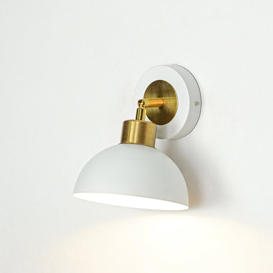 Wall light with white dome shade and gold metal mount ideal for bedroom or living room wall decor placement on clean background.