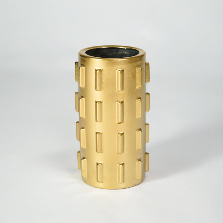 Gold metal planter pot for luxury coffee table placement and modern indoor decor styling accent display piece.