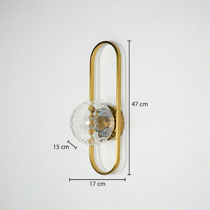 Gold metal wall light with sculpted glass shade sized 47 cm height 17 cm width and 15 cm depth ideal for wall decor installation.