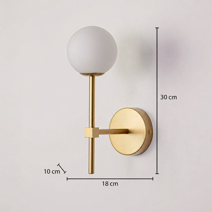 This gold-colored wall light is depicted with dimensions of 30 cm in height, 18 cm in width, and a wall depth of 10 cm, clearly showcasing the product's proportions against a deeply textured background.