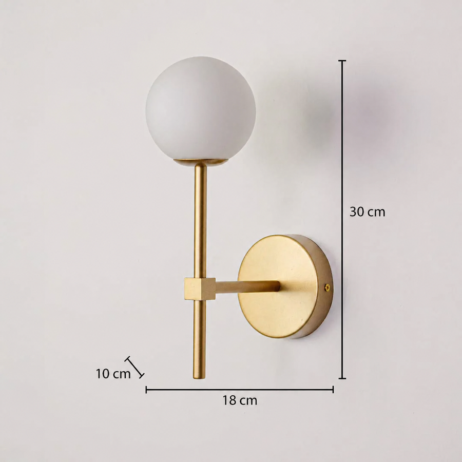 This gold-colored wall light is depicted with dimensions of 30 cm in height, 18 cm in width, and a wall depth of 10 cm, clearly showcasing the product's proportions against a deeply textured background.
