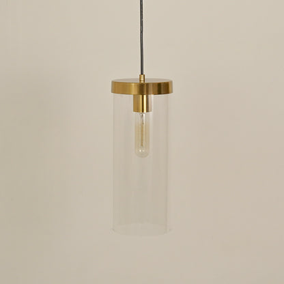 Clear glass tube pendant light with brushed brass finish designed for modern interiors.