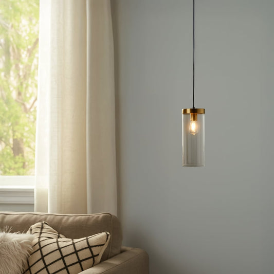 Modern metal cage pendant light hanging on a cozy balcony nook with wicker seating potted plants and warm ambient glow enhancing the outdoor corner.